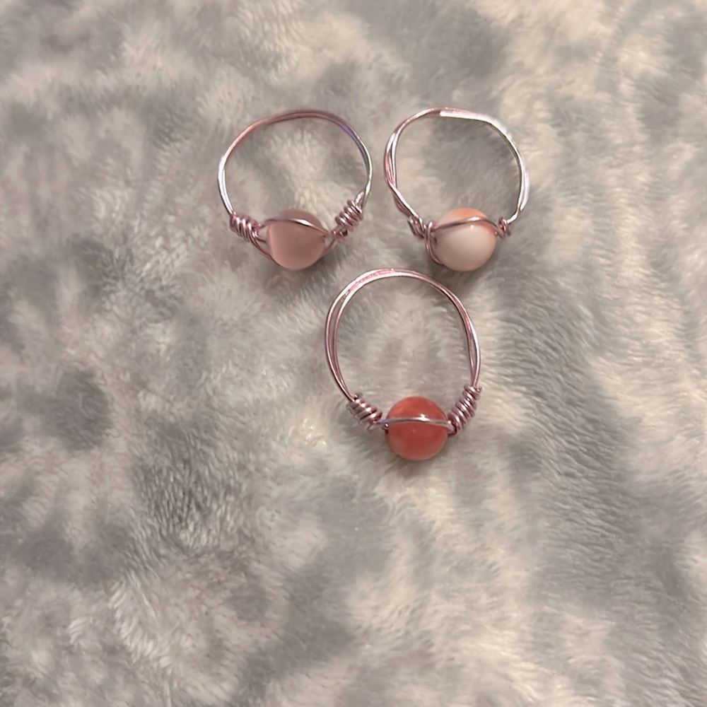 These are 3 handmade rings and they are pink!